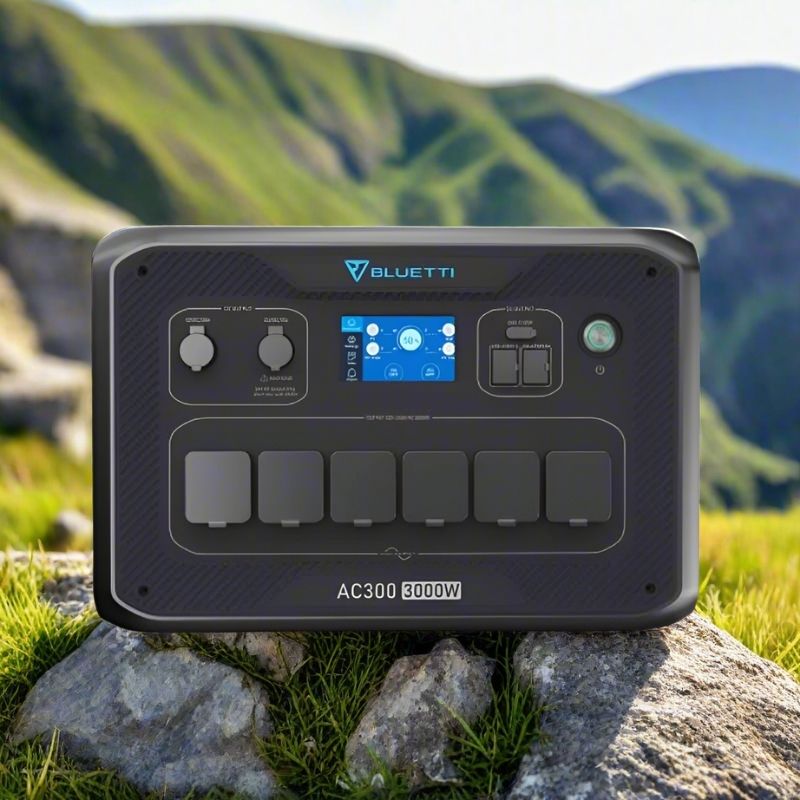 Front view of Bluetti AC300 portable power station on rock.