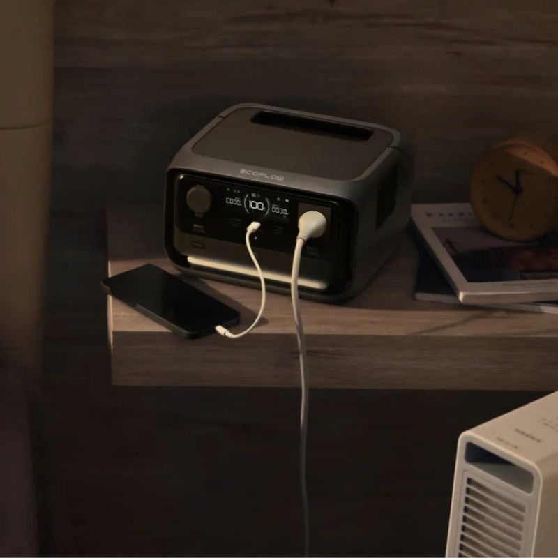 EcoFlow River 3 Plus Max charging smartphone from bedroom shelf