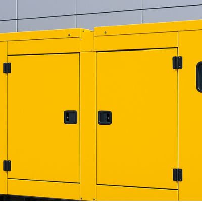 Bright yellow commercial generator outside a modern grey building