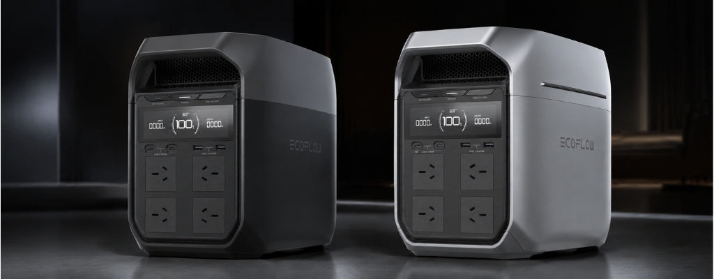 Side-by-side comparison of two EcoFlow portable power stations, one dark gray and one silver, in a professional studio setup, showing design differences and digital screens, with soft directional lighting and subtle reflections.