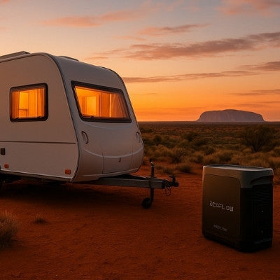 Modern travel trailer and EcoFlow power station at sunset outback