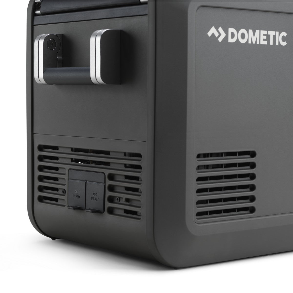 Rear corner of the Dometic CFX5 25 showing the ventilation grille and the 12 volt and mains sockets
