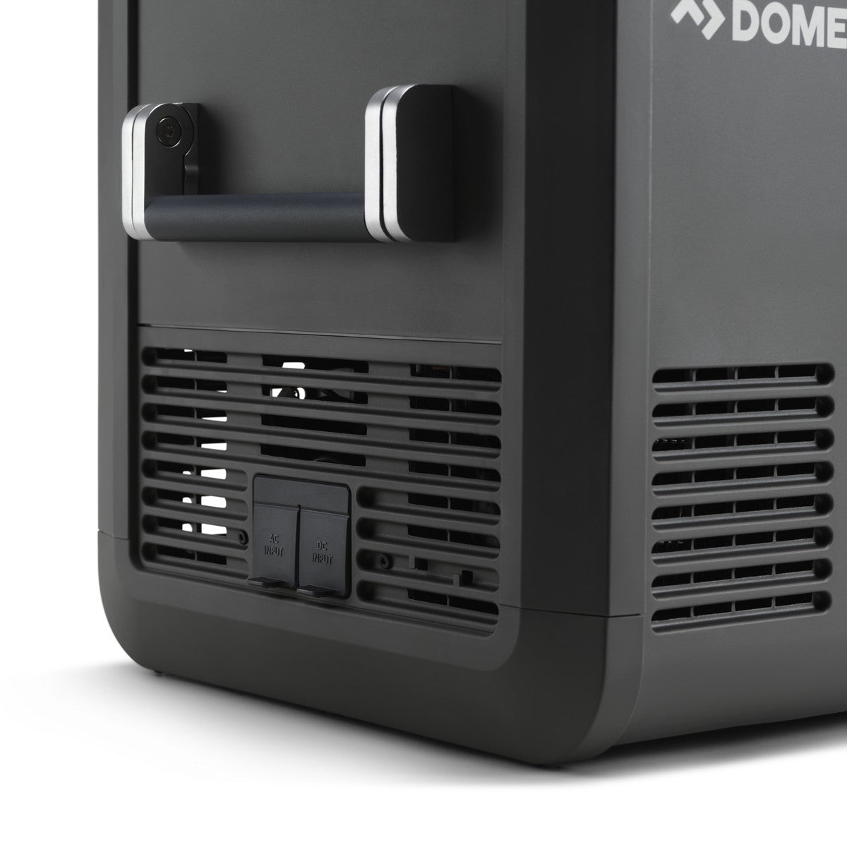 Rear corner of the Dometic CFX5 55 showing the ventilation grille and the 12 volt and mains sockets
