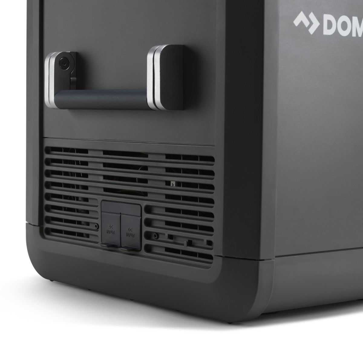 Rear corner of the Dometic CFX5 75DZ showing the ventilation grille and the 12 volt and mains sockets