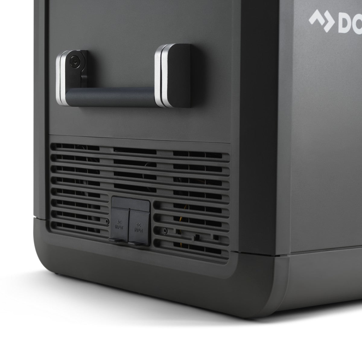 Rear corner of the Dometic CFX5 95DZ showing the ventilation grille and the 12 volt and mains sockets