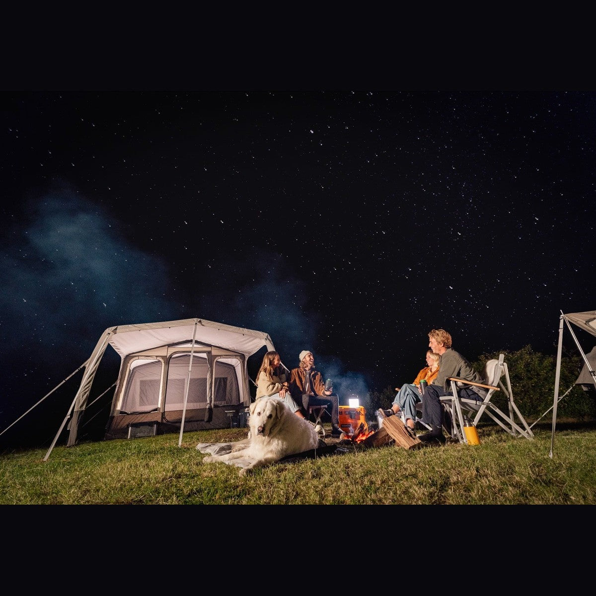 Santorini FTK 4x8 lit up at night with people gathered around a campfire