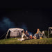 Santorini FTK 4x8 lit up at night with people gathered around a campfire