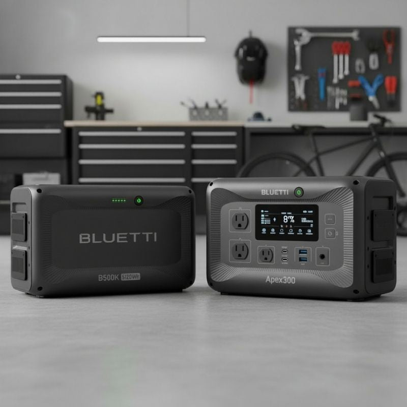 Dark grey portable generators compatible with each other lying on the ground.