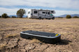 Mark 2 Air Conditioner Smart Battery in open field with a RV in the background.