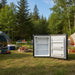 Portable fridge used in a camp ground