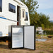 Portable fridge placed outside a caravan