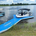 Aquadeck Inflatable Y Pontoon with a blue design near the shore