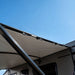 Black Aussie Traveller Anti-Flap Kit PRO+ installed on caravan awning side view