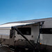Black Aussie Traveller Anti-Flap Kit PRO+ installed on caravan awning