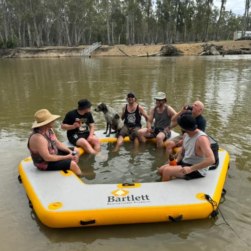 Bartlett 3.5m Hex Deck Water Hammock floating in water with a group of people