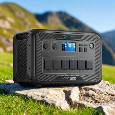 Bluetti AC500 power station on rock with front ports visible.