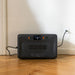 Bluetti Apex 300 portable power station charging indoors from wall socket