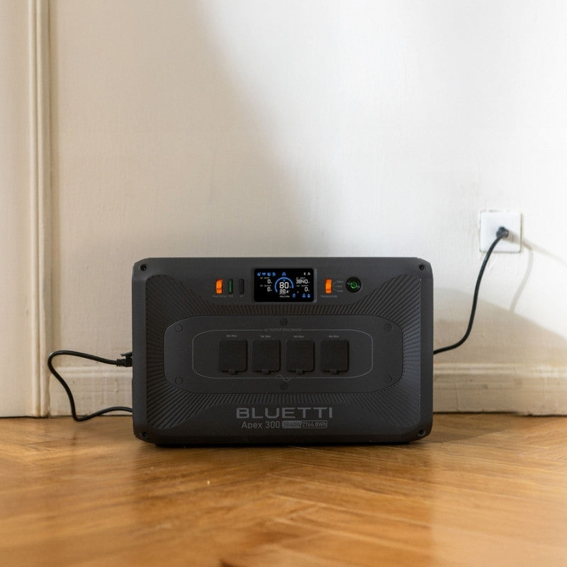Bluetti Apex 300 portable power station charging indoors from wall socket