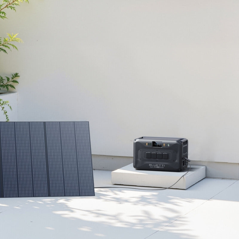 Bluetti Apex 300 connected to solar panel for outdoor home charging