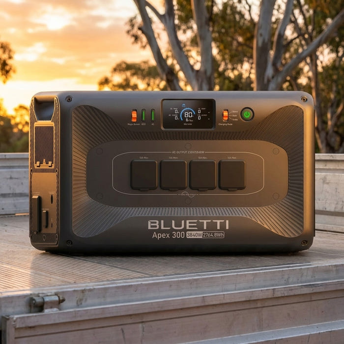 Bluetti Apex 300 portable power station on the tray of a ute at an Australian bush campsite at sunset