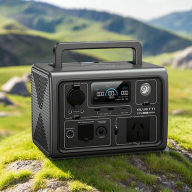 Bluetti EB3A power station with handle and visible ports outdoors.