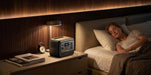 Bluetti Premium 100 V2 quietly powering devices beside bed for overnight use.