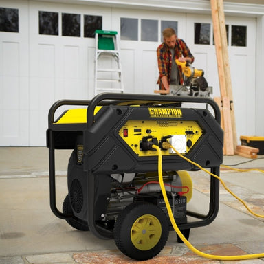 Champion 12500W generator powering tools on jobsite construction crew garage setting