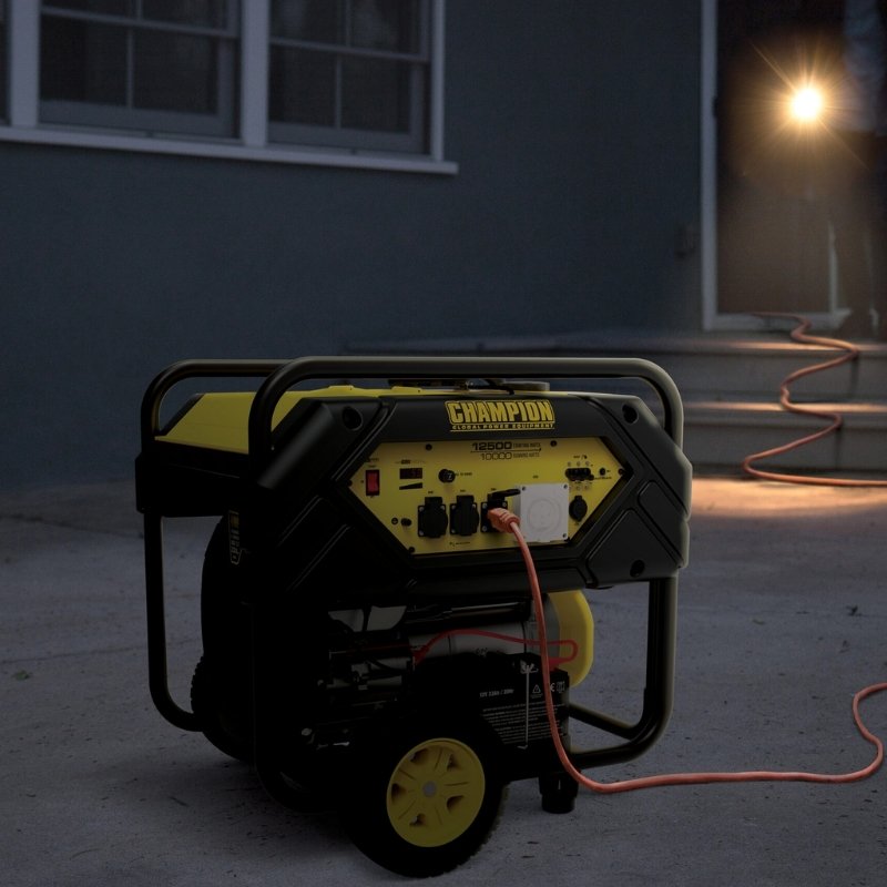 Champion 12500W portable generator running outdoors at night powering home lights