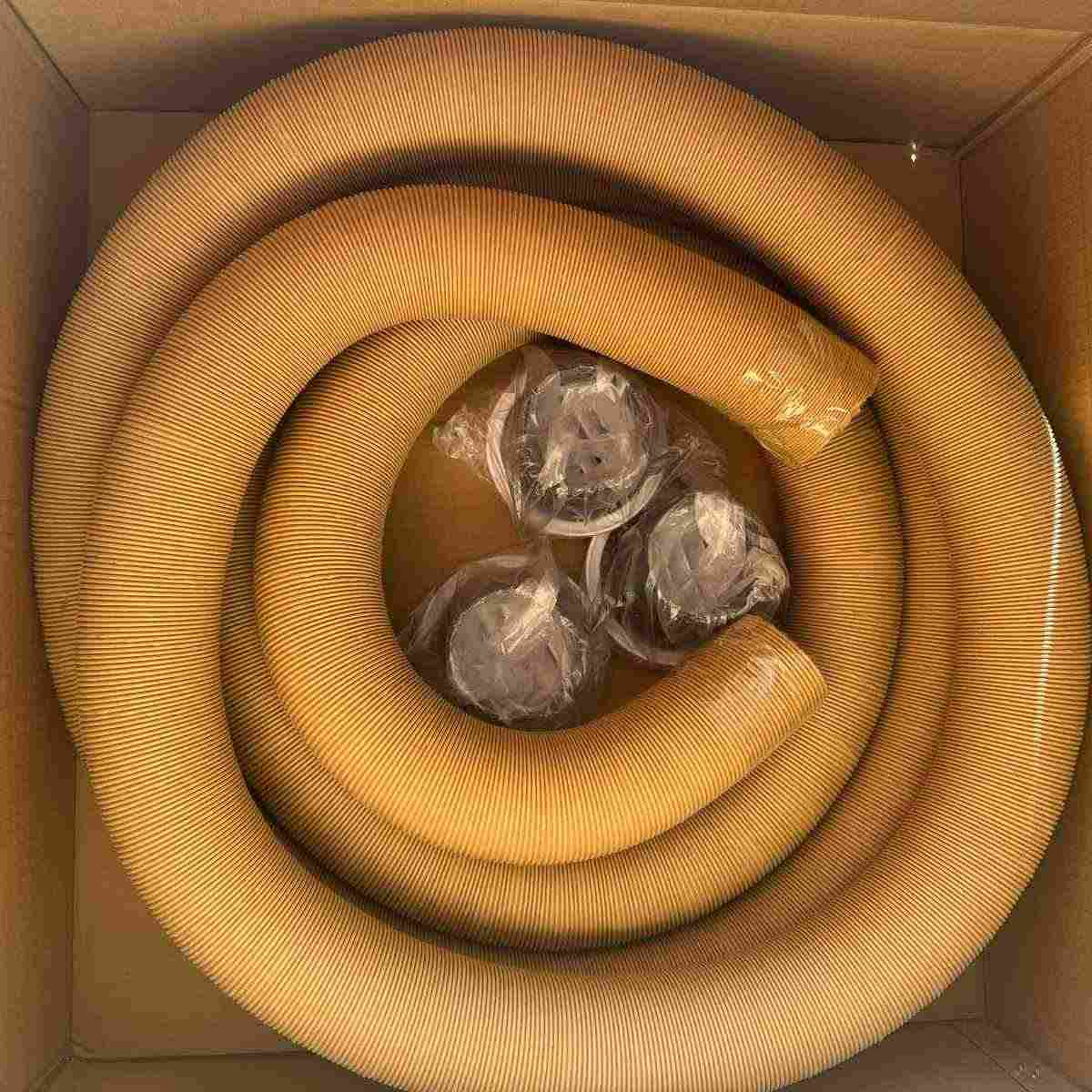 Coiled 10 metre ducting and three air outlet vents packed in the Cool-J ducting kit box