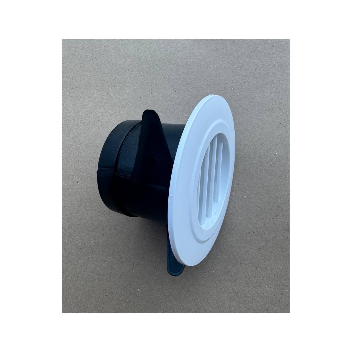 White air outlet vent showing the ducting collar at a three-quarter angle