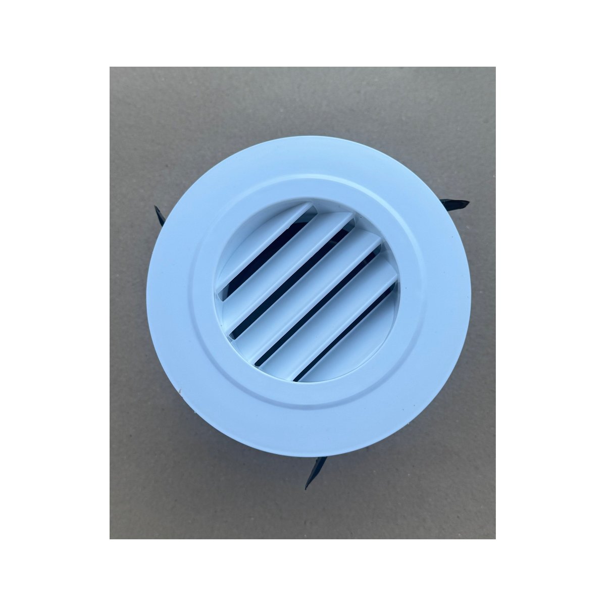 White round air outlet vent from the Cool-J ducting kit, front view