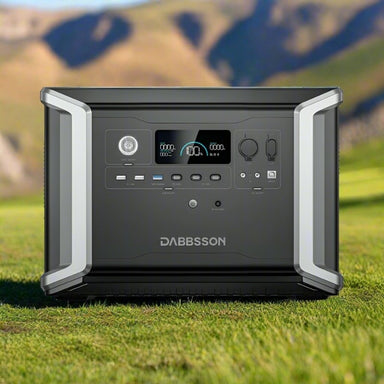 Dabbsson DBS2300 portable power station on grass outdoors with digital display showing 100 percent charge