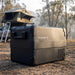 Dometic CFX2 37 portable fridge freezer at a bush camp under a rooftop tent in soft morning light