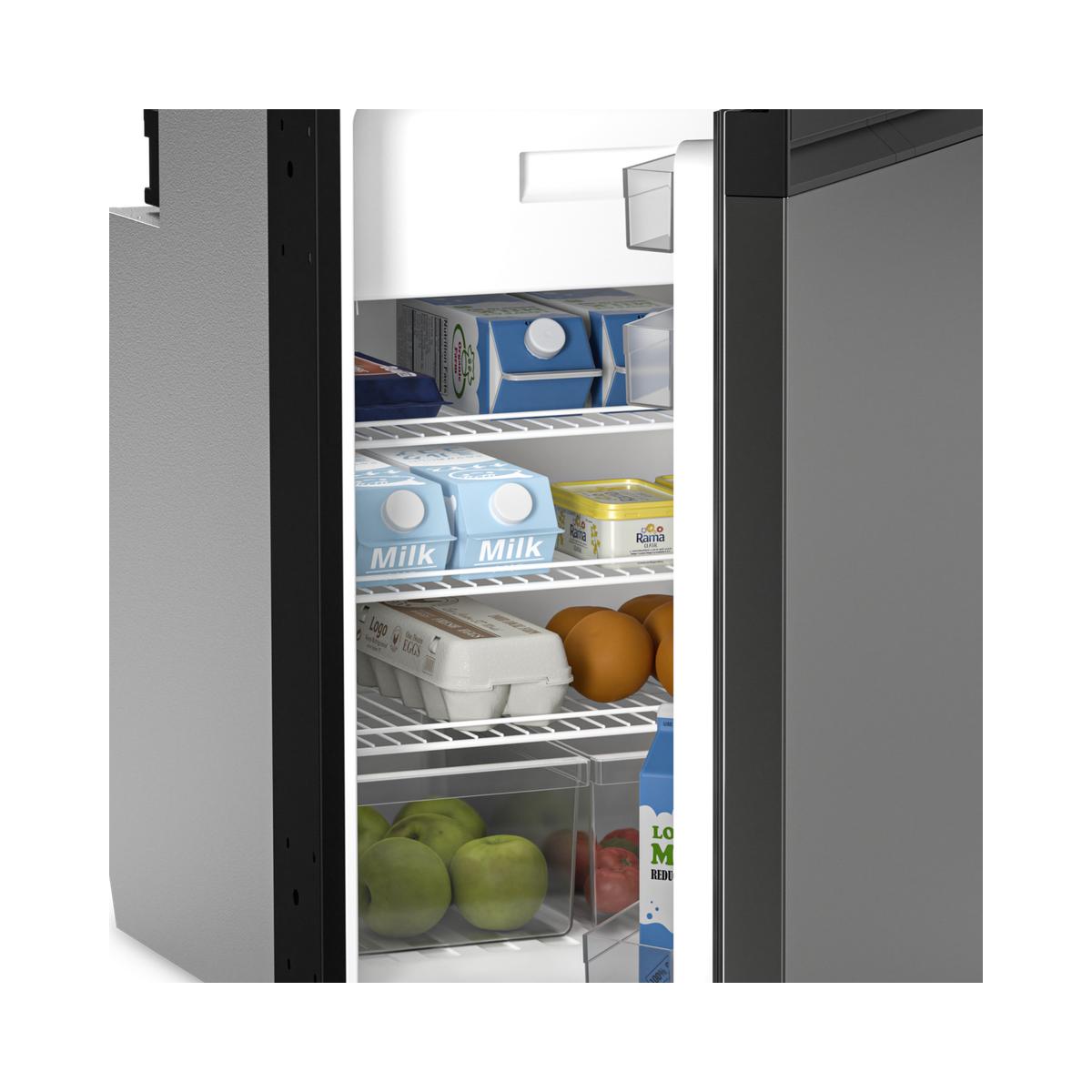 Milk, eggs and fruit on the shelves inside a Dometic NRX fridge cabinet