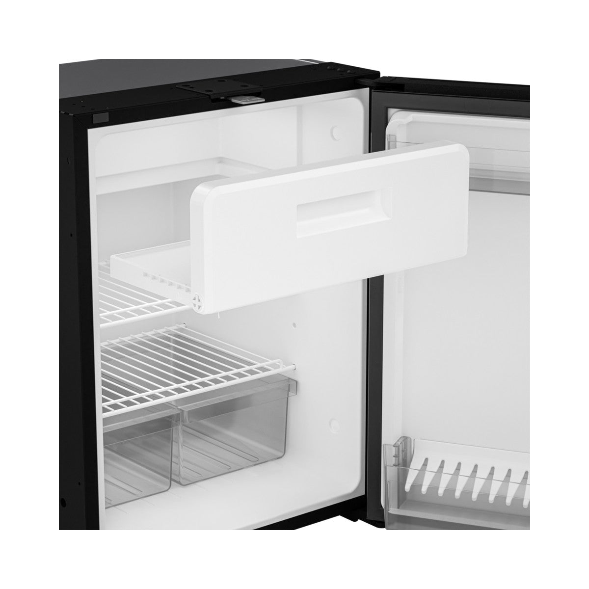 The removable freezer box being lifted out of a Dometic NRX fridge
