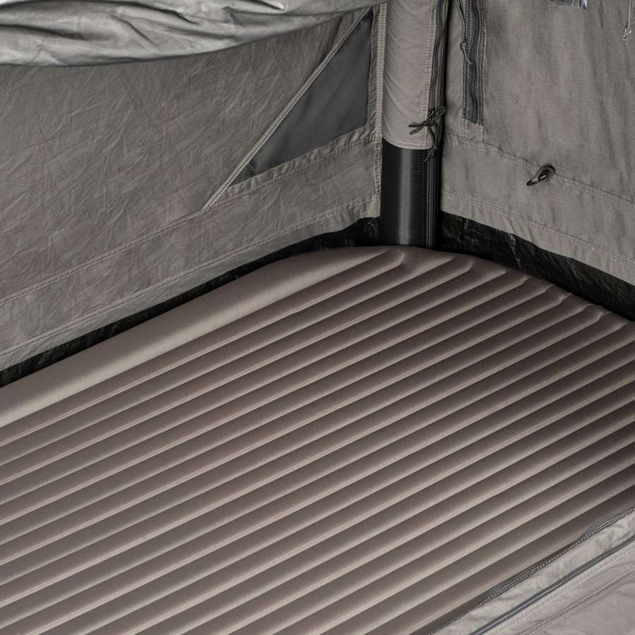 Inside the Dometic Pico FTC 1x1 TC-I looking down the ribbed I-beam inflatable mattress to the rear wall