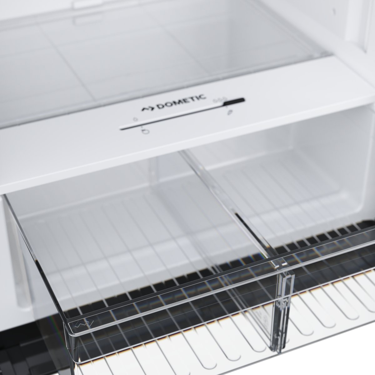 Full-width crisper drawer holding apples and oranges inside a Dometic RCD10.5XES