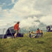Dometic Reunion FTG 4x4 Redux pitched on a mountain flat beside a 4WD with a family at a camp table