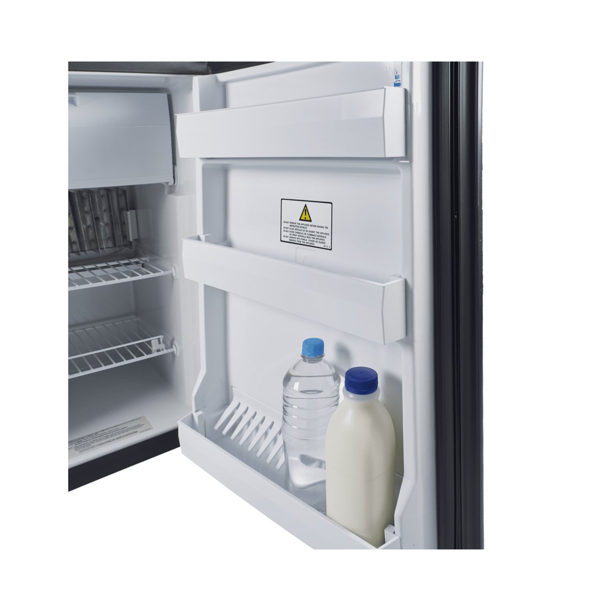 Open door of the Dometic RM 2350 with bottles and milk in the door storage