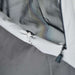 Close-up of the toggle and zip pull on the sidewall panel edge