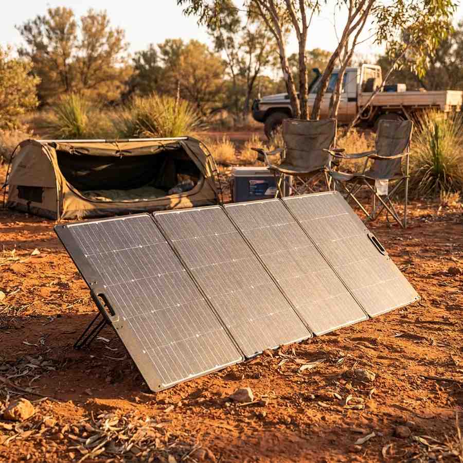 EcoFlow 400W Lightweight Bifacial solar panel set up at an Australian bush campsite with a swag and camp chairs at golden hour