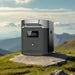 EcoFlow DELTA 2 Max Smart Extra Battery on a rock with scenic mountain backdrop