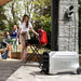 Woman grilling during outdoor BBQ with EcoFlow DELTA Pro powering the setup