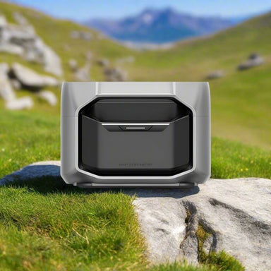 EcoFlow DELTA Pro 3 Smart Extra Battery on a rock in grassy mountain landscape