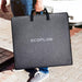 EcoFlow solar panel carry case being held, showing lightweight portability.