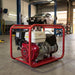 Genelite GH6000-AVR 7.5kVA generator on the floor of an Australian mechanical workshop with a vehicle hoist in the background