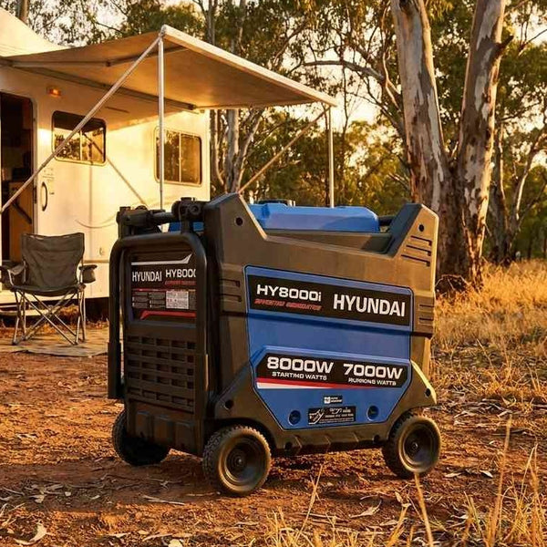 Hyundai HY8000i 10kVA inverter generator centered at an Australian free camp beside a motorhome at golden hour
