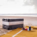 MyCOOLMAN 85L fridge freezer set up on a beach with picnic spread