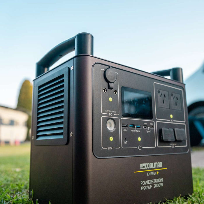 myCOOLMAN 1920Wh power station sitting on grass at the tailgate of a ute