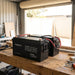 Two Renogy 12V 200Ah batteries wired in parallel on a shed workbench